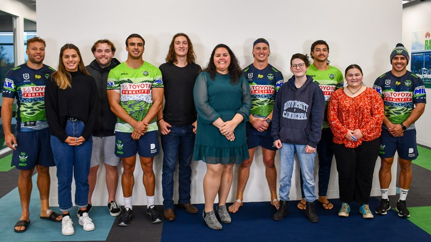 Artist Kayannie Denigan with Raiders Indigenous players and NRL School to Work participants. 