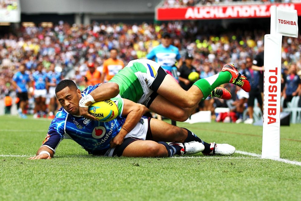 Warriors' Suaia Matagi scores a try against Raiders' Jarrod Croker. Day One of the Dick Smith NRL Auckland Nines, Eden Park, Auckland, New Zealand. Saturday 15th February 2014. Photo: www.photosport.co.nz