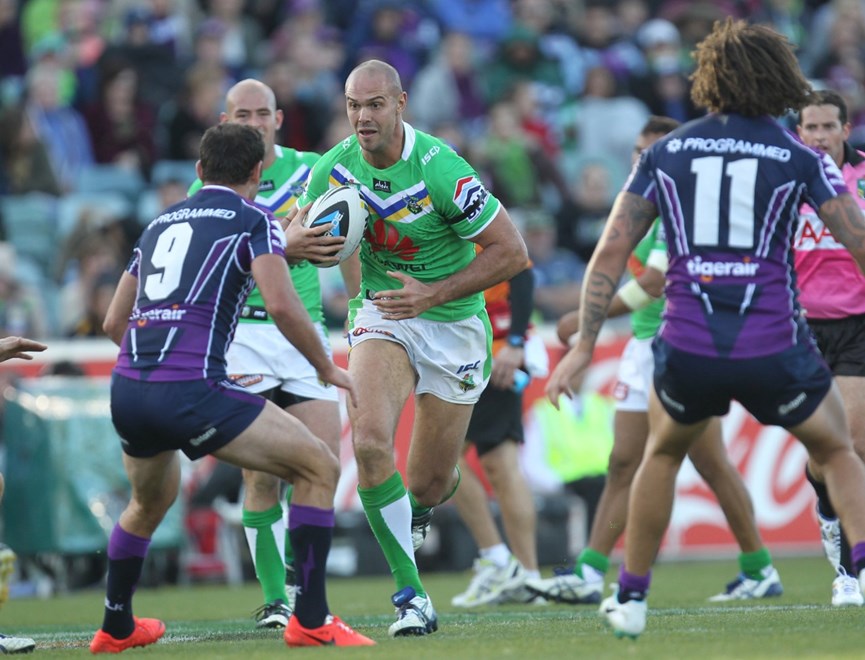 Photo by Colin Whelan copyright © nrlphotos.com :   Dane Tilse sizes up Cam Smith   NRL Rugby League, Telstra Cup Round 7 Canberra Raiders v Melbourne Storm at Canberra, Sunday, April 20th  2014.