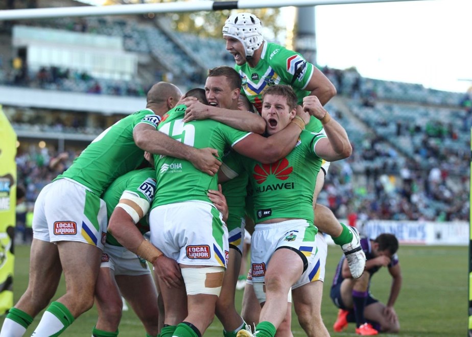Photo by Colin Whelan copyright © nrlphotos.com :   The Raiders celebrate the winning try to Paul Vaughan  with Storm capt in the background  NRL Rugby League, Telstra Cup Round 7 Canberra Raiders v Melbourne Storm at Canberra, Sunday, April 20th  2014.